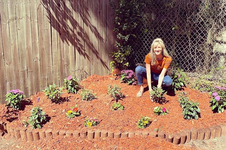 Gloria Brooks plants magnolia, milkweed, porter weed, and passion vine in her butterfly garden.