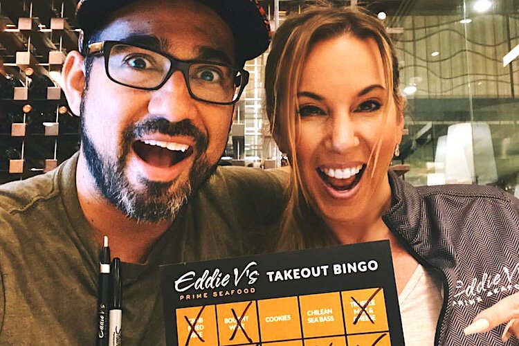 Eddie V's Executive Chef Taro Larrea and Sales Manager Kim Kramer with Tampa Bay TakeOut Bingo Cards in Tampa.
