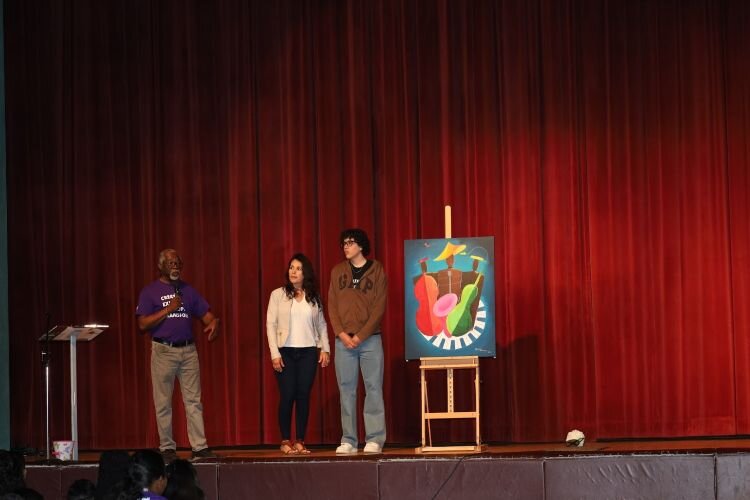 Prodigy ambassador Edwin, who started in the program as a 14-year-old high school freshman, is recognized for his artwork during the Prodigy showcase event at the University Area CDC Community Center in March 2024.