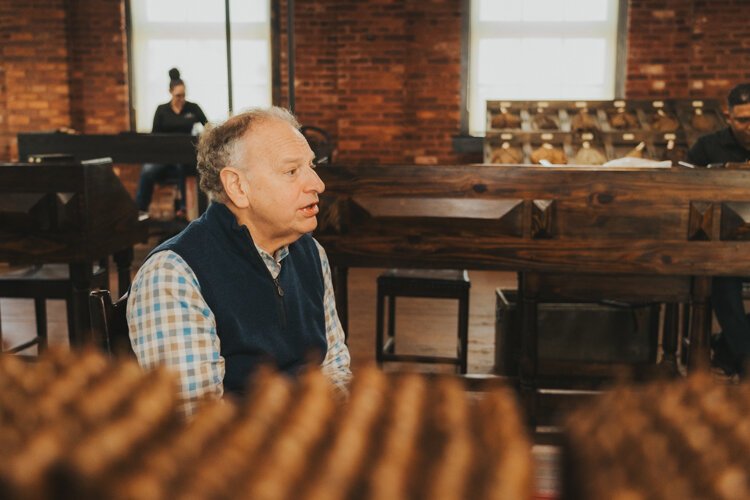 J.C. Newman President Eric Newman shares the family-owned cigar company's history while seated in the American room of the El Reloj cigar factory in Ybor City. "Nobody has a story like ours," Newman says.