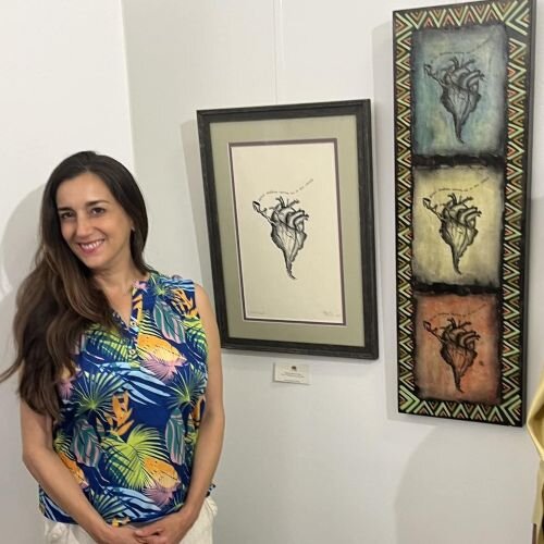 Gabriela Valencia, a St. Pete artist and violin teacher who sits on the Coaltion of Hispanic Artists Communication and Education Committee, with her artwork