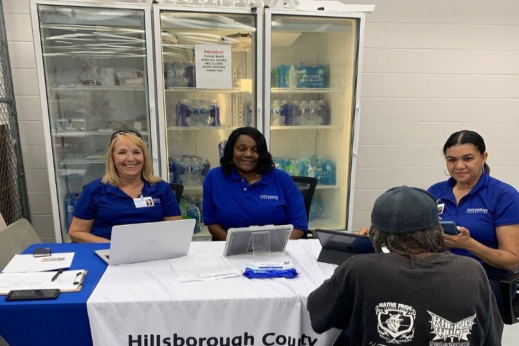 Navigatros with the Family Healthcare Foundation at an enrollment event for the Hillsborough County Health Plan, one of the lower-cost, subsidized health coverage programs in which the nonprofit helps people enroll.