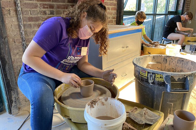 Teens and adults especially enjoy throwing pots at the Morean.