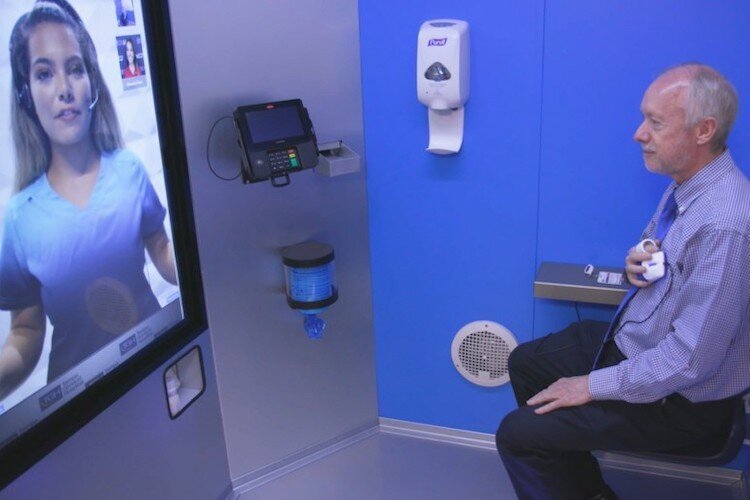 Patients consult with a physician inside the privacy of a booth.