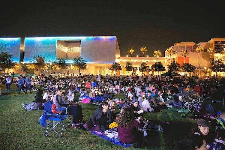 A holiday-inspired crowd packs into Winter Wonderland at Curtis Hixon Waterfront Park in 2018 to watch parkCINEMA's latest movie.