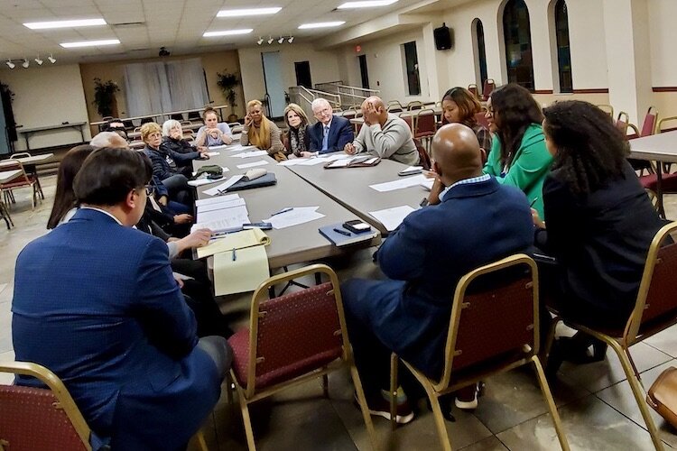 Lynching committee members strategize fundraising for recognition of historic lynchings.