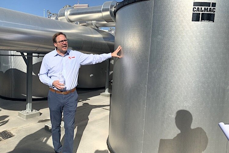 Tampa Bay TRANE VP Stephen Koontz explains the role of 98 ice storage tanks at the District Cooling facility.