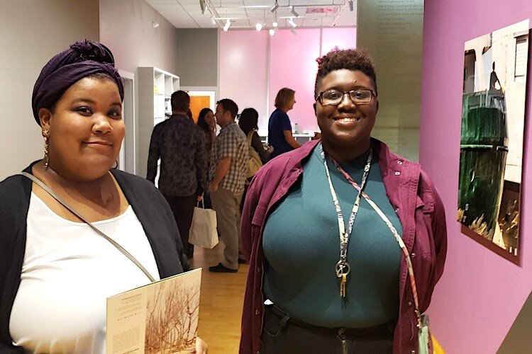 USF students Marcela Gonzalez, (studio art/painting program), and Khali Robinson (animation) visit FloodZone opening at USF CAM.