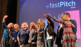 fastPitch 2020 competitors share cheers.