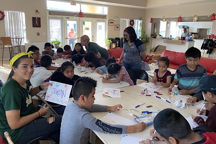 Kids at Wholesome Winter Kids Camp create "personal flags" to showcase their personalities and favorite things.