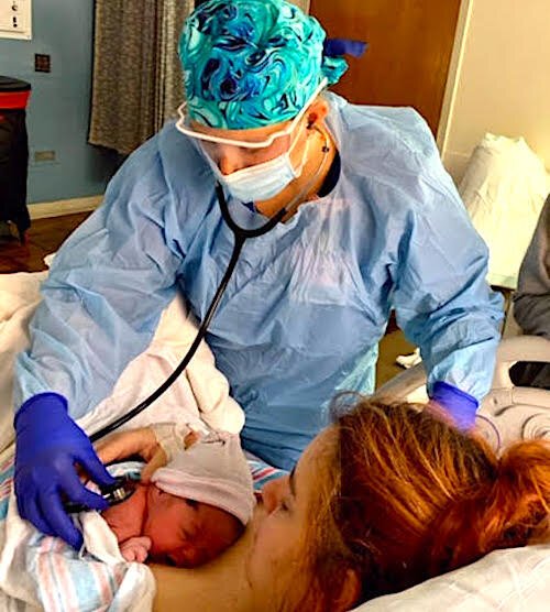 A newborn and mom shortly after delivery.