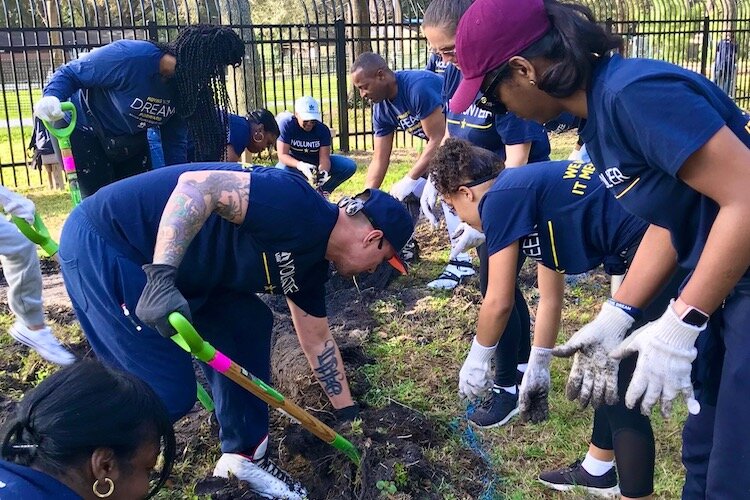 Neighbors and volunteers pitch in together to create improvements in at-risk neighborhoods.