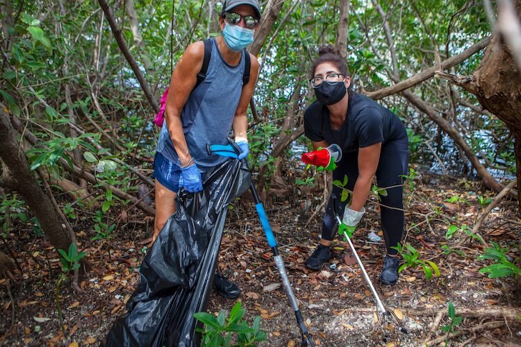 Gorrie Elementary Principal Marjorie Sandler (left) helps with the regular river cleanups.