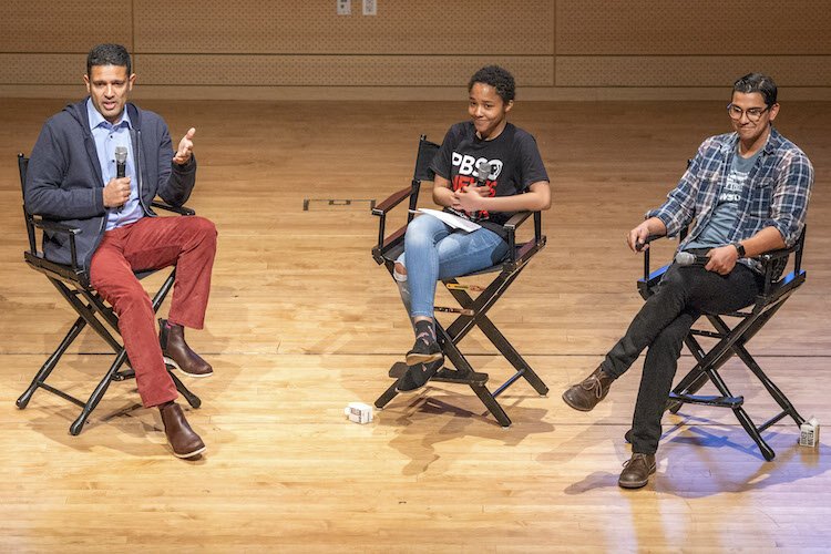 MediaWise Senior Multimedia Reporter Alex Mahadevan (right) and PBS Newshour Weekend anchor Hari Sreenivasan (left) teach more than 200 students at a MediaWise Voter Project event in New York City.