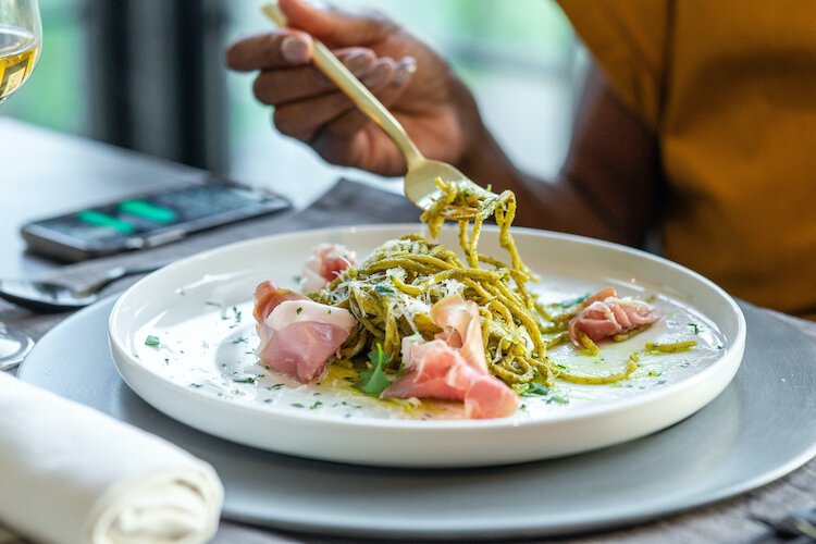 One of Pasta Pack’s newest menu items, spaghetti alla pesto with prosciutto di parma. The fresh spaghetti noodle is tossed in a pine nut pesto for an herby, nutty, and refreshing flavor.