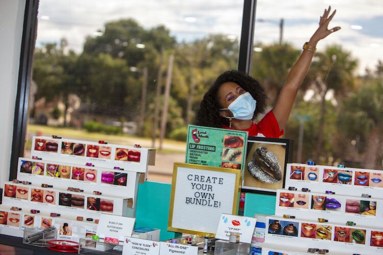 Amber Parker of "Loudmouth Lip Attire,’’ a makeup and lipstick line that's chemical/gluten/cruelty-free, participates in Buy Black Saturday.