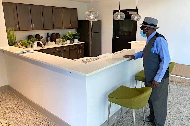 Resident Clinton Mollins checks out his new apartment at the new Mary Bethune High-Rise.