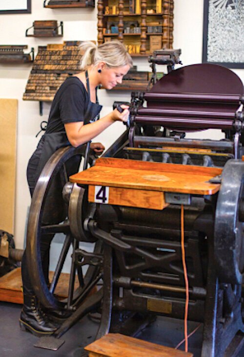 Labyrinth Founder Ali Norman works on an array of equipment in her new makerspace. 