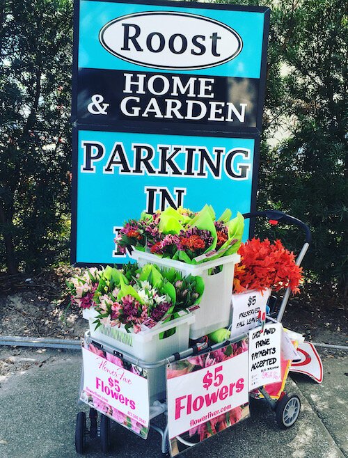Entrepreneur Linda Quinn takes her pop-up flower buggy around Tampa neighborhoods. 