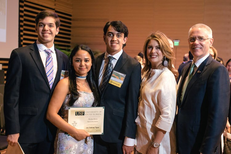 Scholarship winner Marilyn Deras with her sponsors and USF President Steven C. Currall.