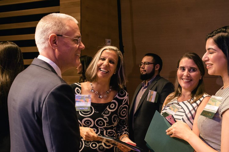 USF President Steven C. Currall congratulates scholarship winners.