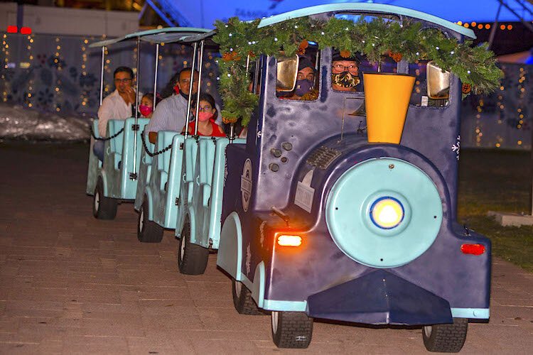 The Winter Village Choo-Choo, a 12-seat, three-car trackless train, makes 10-minute loops around Curtis Hixon Waterfront Park during the evening light shows. Train cars are limited to one family at a time due to COVID.