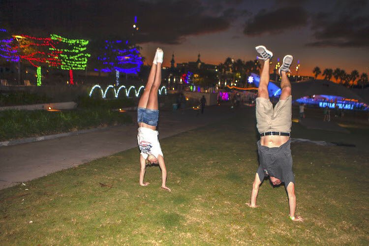 Roger LaPerna of Tampa practices handstands with daughter, Peyton, 12, at the Winter Village at Curtis Hixon Waterfront Park.