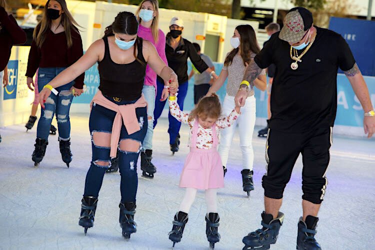 New Port Richey's Stormie Banks visits Winter Village in Downtown Tampa for a skating session with her fiance, Joey Vitello, and her daughter Aryanna, 4.