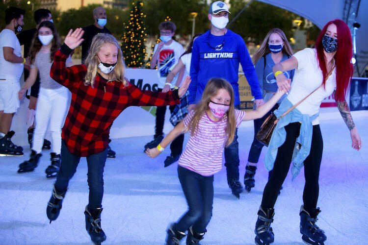 Leslie Toledo skates at Winter Village at Curtis Hixon Waterfront Park along with her daughters, Amina, 11, and Emma, 7.