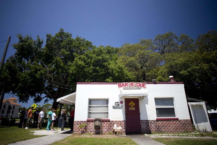 Patrons line up off the Pinellas Trail to pick up food at Eli's Bar-B-Que in Dunedin.