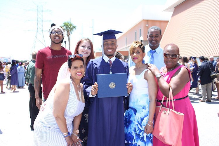 A family celebrates a recent college graduate in Tampa.