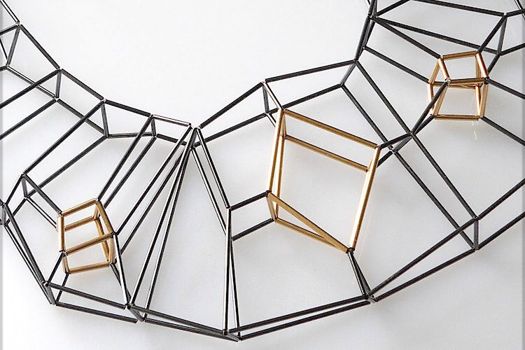 Panama City artist Emilie Pritchard creates engineered structures such as “Diamond” an 11-inch long necklace fashioned from oxidized sterling silver, 14 karat-gold-filled tubes and thread.