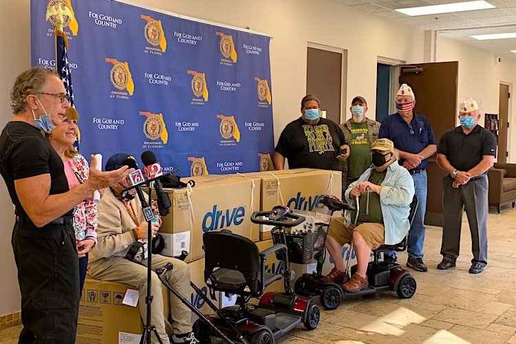 Scooter philanthropists give greater mobility to 17 Florida veterans