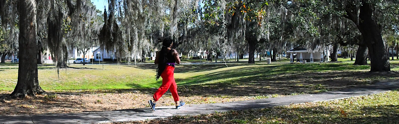 As a lone jogger provides a bright spot in an otherwise deserted park at Belmont Heights Estates, walkers suggest that the addition of benches might attract residents to visit and relax in this natural setting.