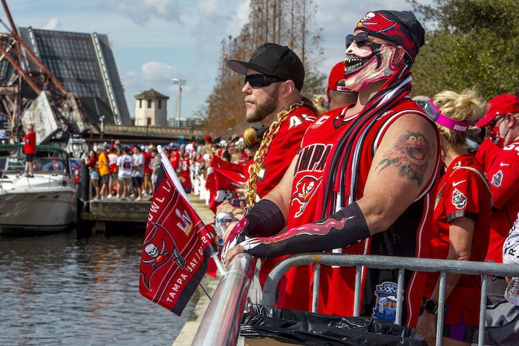 St. Pete's Tony Ortego, right, said he arrived early to secure a good viewing sight along Tampa's Riverwalk on the Hillsborough River.