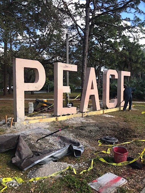 The newest statue erected at Harvest Hope Park by local Artist Junior Polo, comprised of letters spelling PEACE.