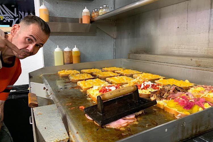 Chef Robert Hesse cooking up some of his cheesy creations.