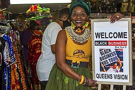 Regina Johnson, proprietor of "Queens Vision African Apparel, welcomes visitors to her boutique on Busch Boulevard during a 2021 Black Business Bus Tour event. A tour is scheduled January 13 as part of the 2024 Tampa Bay Black Heritage Festival.