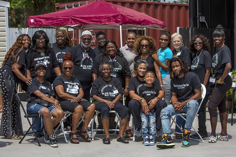 Volunteers and organizers of Saturday's Black Business Bus Tour gather at Big Al's Finger Licking Good Soul Food Saturday afternoon to share friendship, dance and good food.