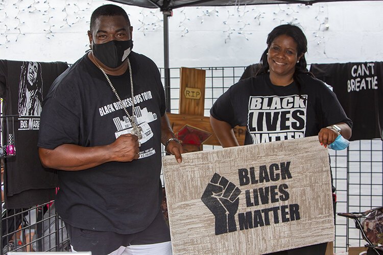 Deanna Hardy-Joseph and Andrew Joseph participate in Saturday's Black Business Tour community celebration at Big Al's Finger Licking Good Soul Food.