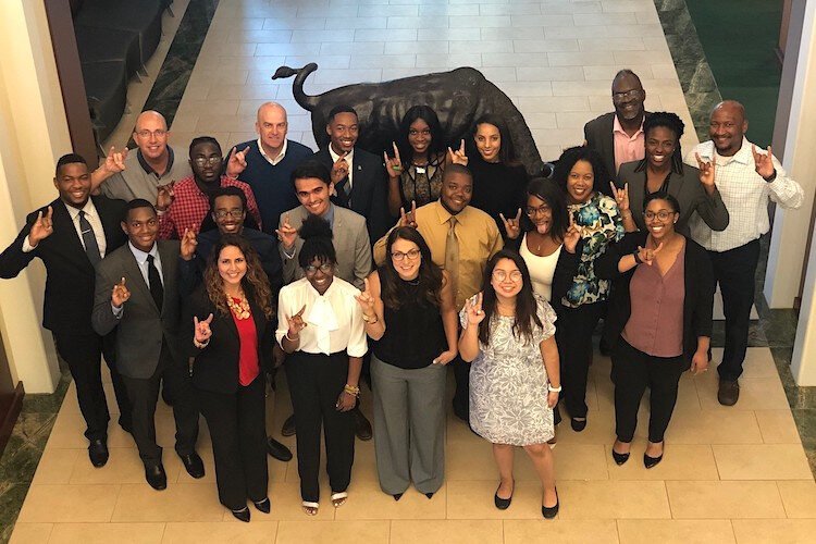 Amgen Employee Resource Group members with USF students following networking and etiquette seminars in 2019.