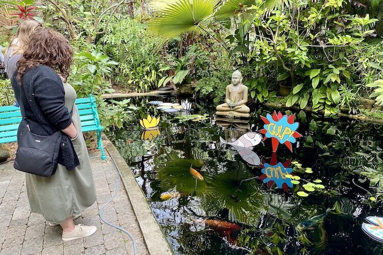 A koi pond in the gardens give reason to pause and reflect.