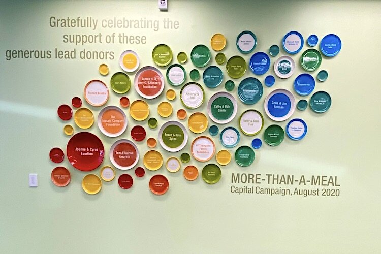A wall of plates at the MOW headquarters on Hillsborough Avenue recognizes donors.