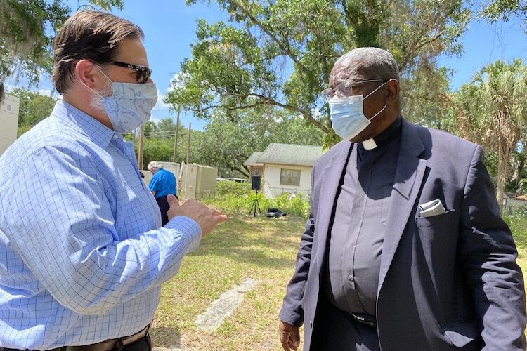 Rodney Kite Powell from the Tampa Bay History Center consults with the Rev. James T. Golden about the upcoming park.