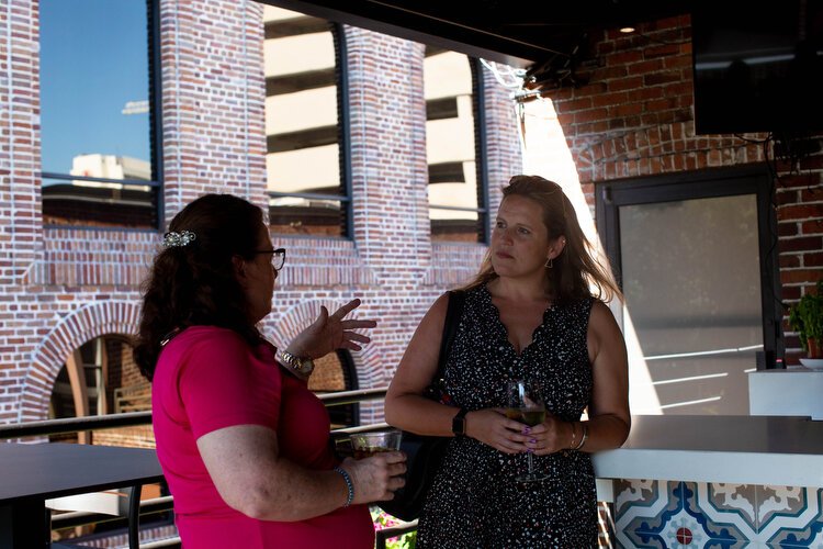 Carla Robinson VP of Professional Systems Printing and Promotions catches up with Betsy Earle with Event Driven Solutions at Red Mesa Cantina.