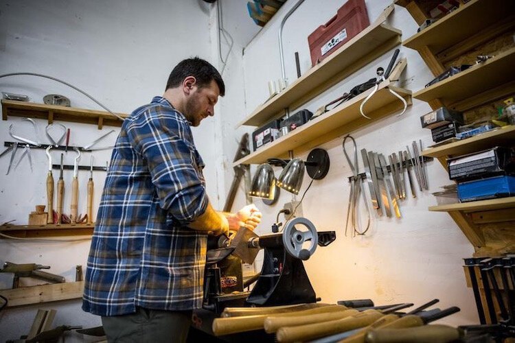 Cole Miles of Tampa flipped houses for profit before launching his woodworking business.