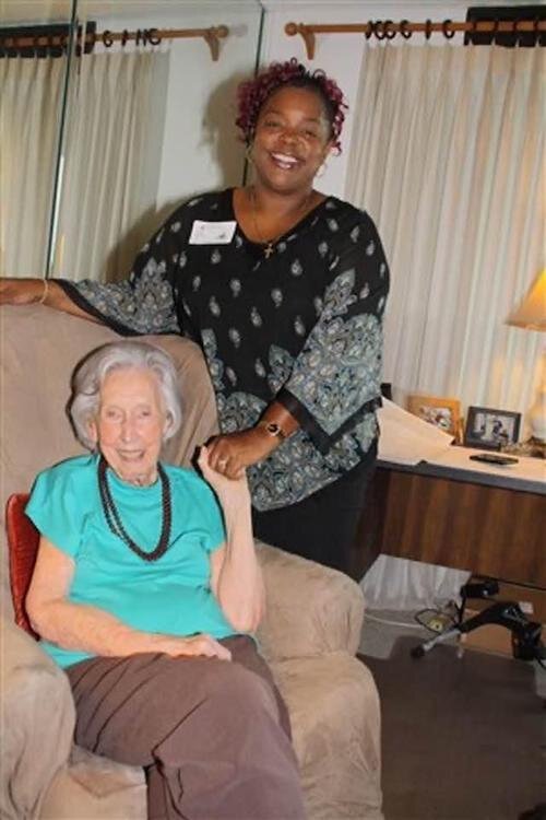 Program Director Linda Chatters-Walker stands next to House of Hope Founder Margaret Palmer, "the chat lady.''