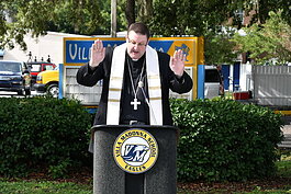Bishop Gregory Parkes offers a blessing at the groundbreaking for a new pavilion at Villa Madonna School.