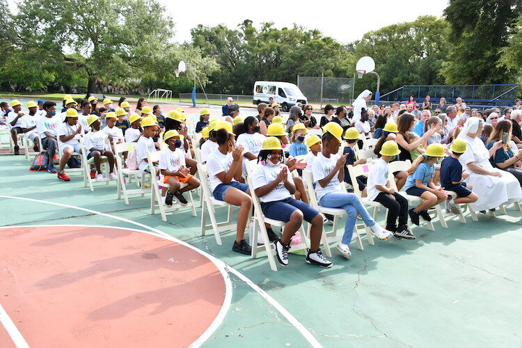 Students at Villa Madonna School and the Salesian Youth Center wore hardhats during a celebration of a $2.77 million renovation now underway at Villa Madonna School in Tampa Heights.