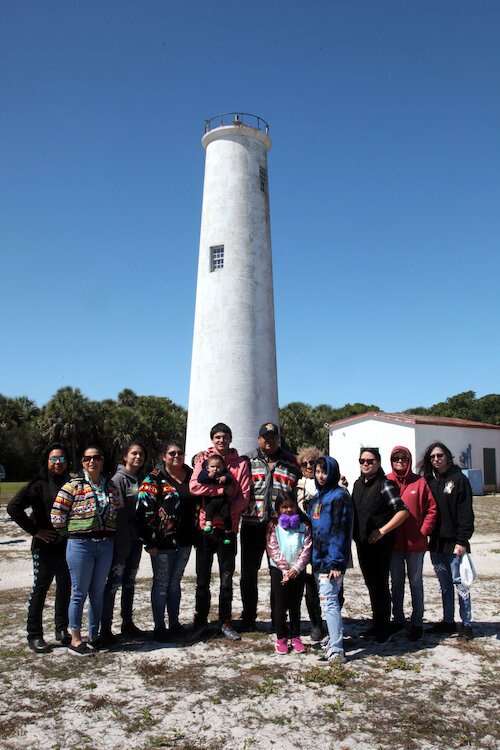 Polly Parker's descendants pictured with the Egmont Key Lighthouse.